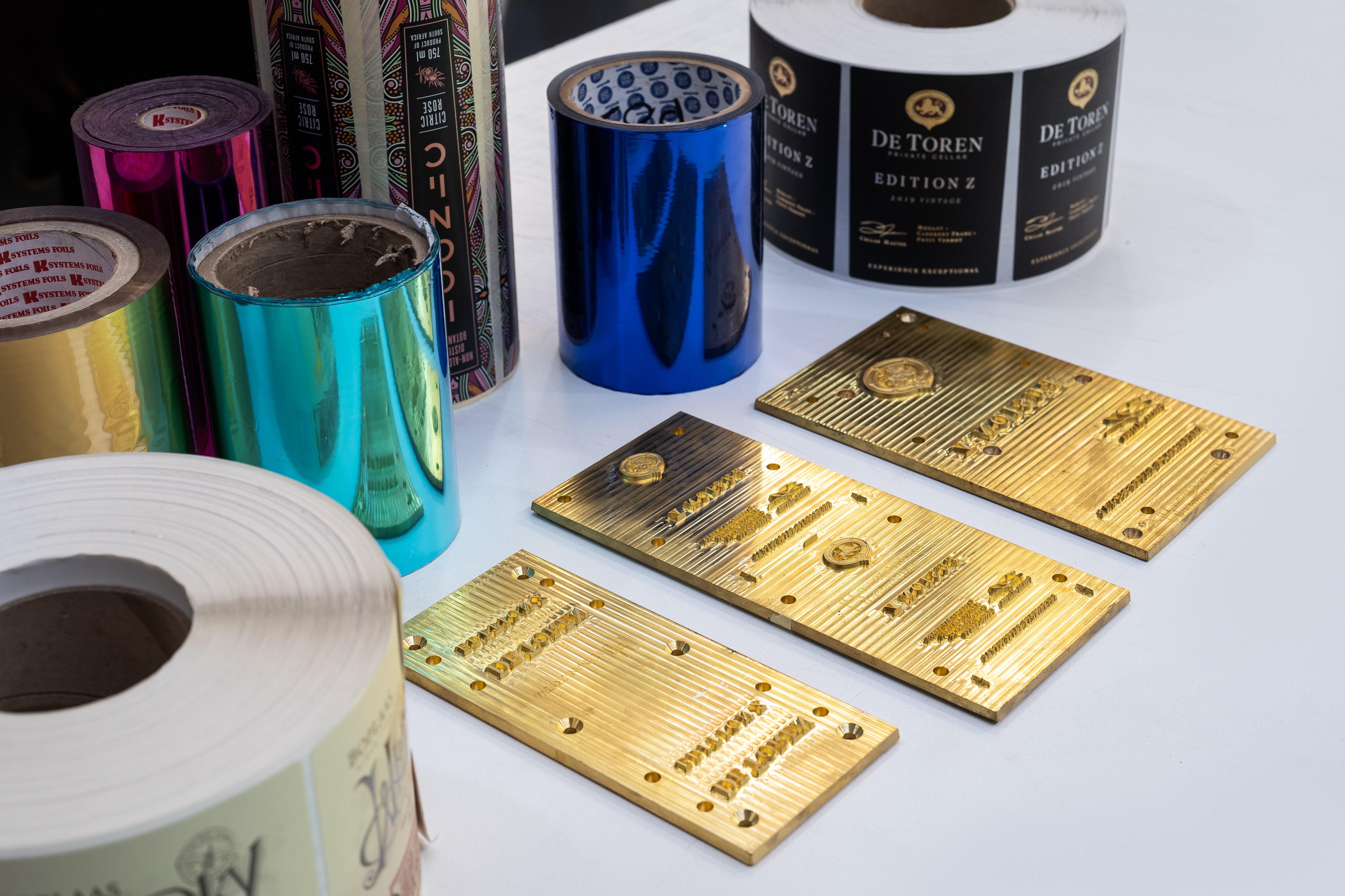 Foil blocks, metallic foil rolls and finished De Toren wine labels