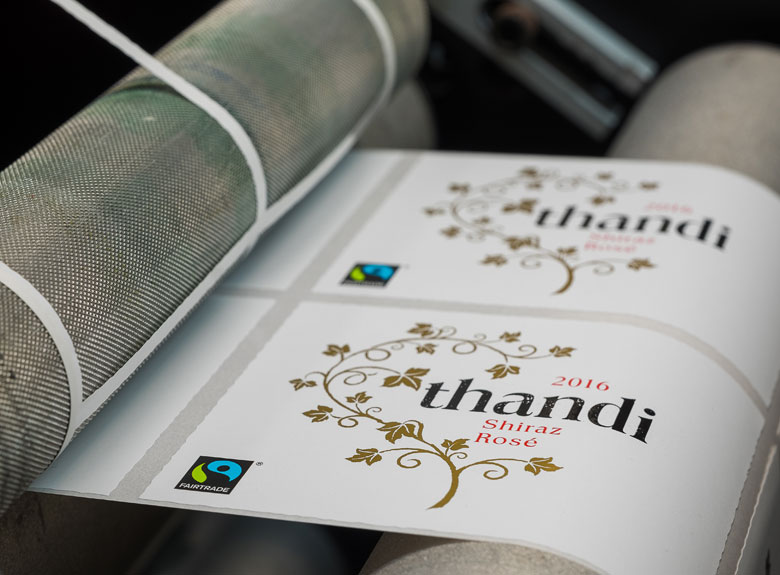 Self-adhesive label rolls on printing press
